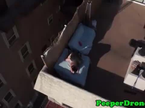 Drone films rooftop sex