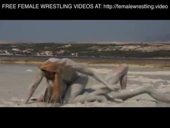 Girls wrestling in the mud