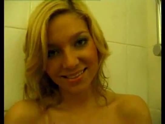 Hot blonde takes a shower and masturbates