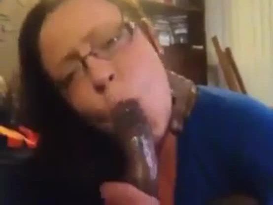 Sexy white chick with glasses sucking black dick