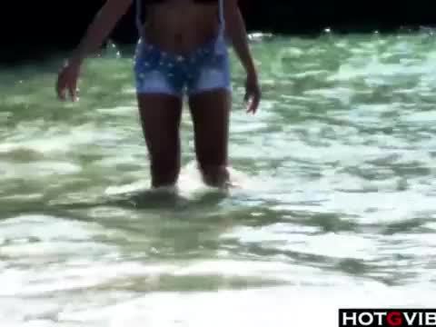 Slim Spanish Latina fucks herself on the beach