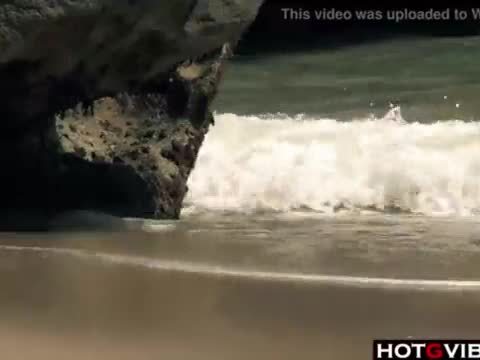 Slim Spanish Latina fucks herself on the beach