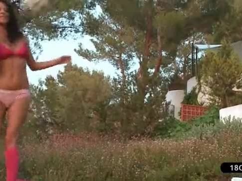 Two Young Lesbians Playing With a Ball in The Garden